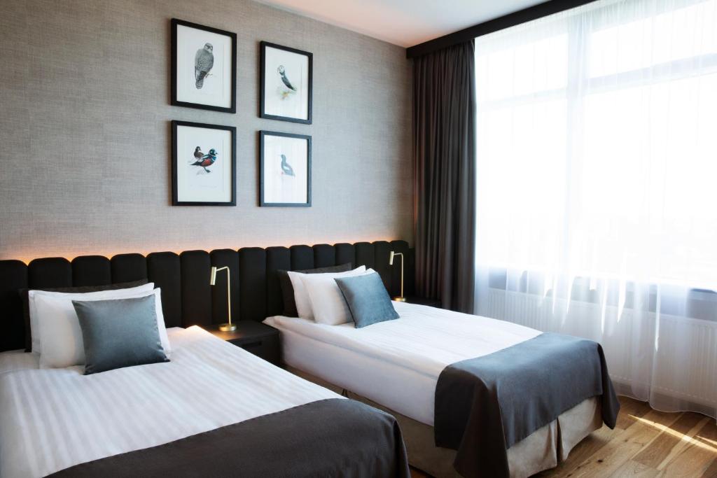 Postel nebo postele na pokoji v ubytování Hotel Reykjavík Grand