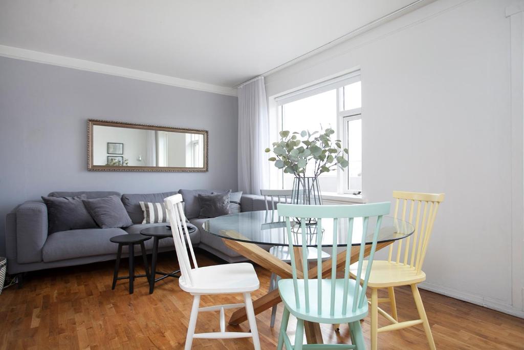 a living room with a table and chairs at Day Dream Laugavegur Downtown Apartments in Reykjavík