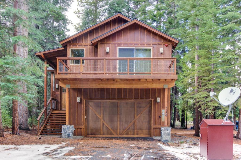 a cabin in the woods with a garage at Tahoma Deluxe Brand New Home in Tahoma