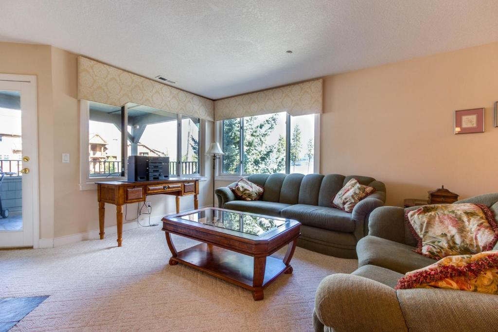 a living room with a couch and a coffee table at Mountain Lake Getaway (B101) in Twin Beaches