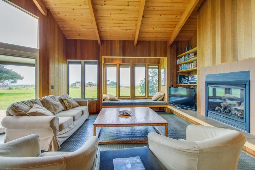 a living room with a couch and a fireplace at Samson Getaway in Sea Ranch