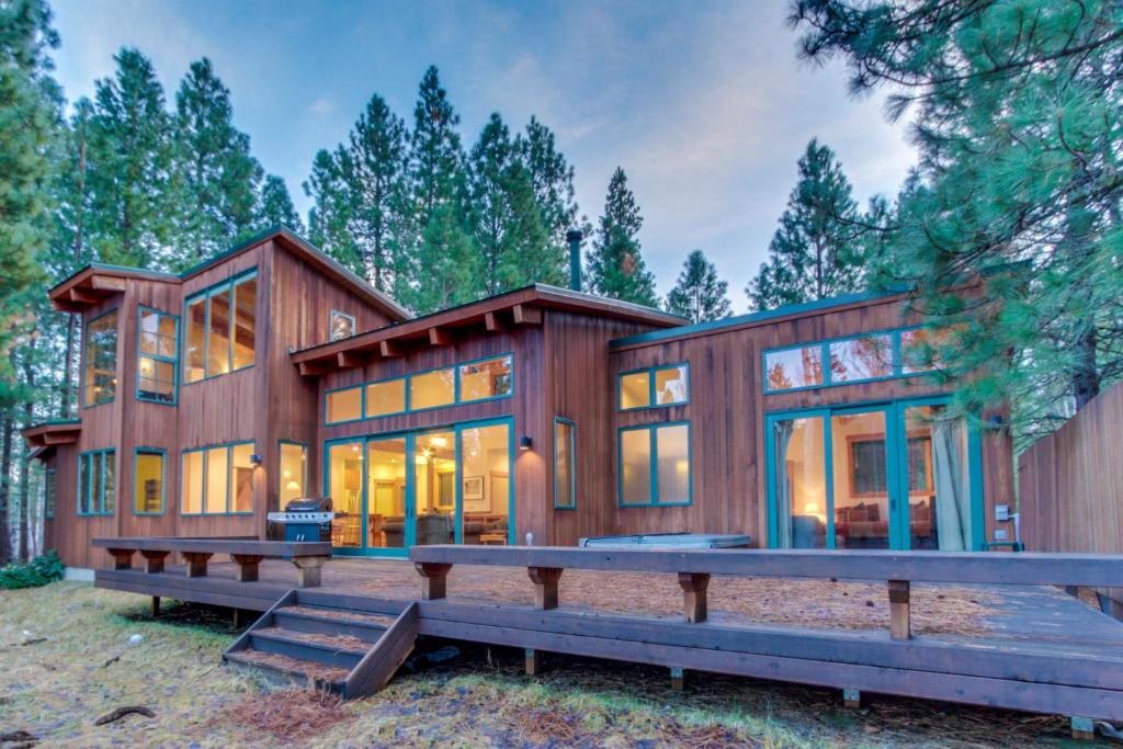 a large wooden house with a lot of windows at Black Butte Ranch: Aspen Grove Retreat in Sisters