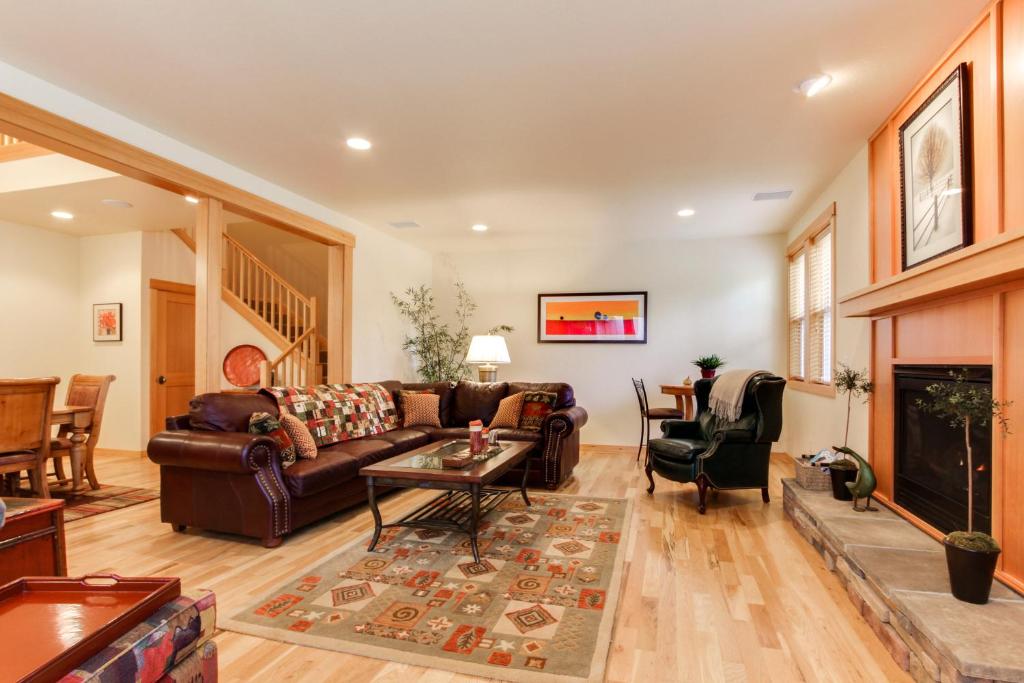 a living room with a couch and a table at 23 Fremont Crossing Sunriver in Sunriver