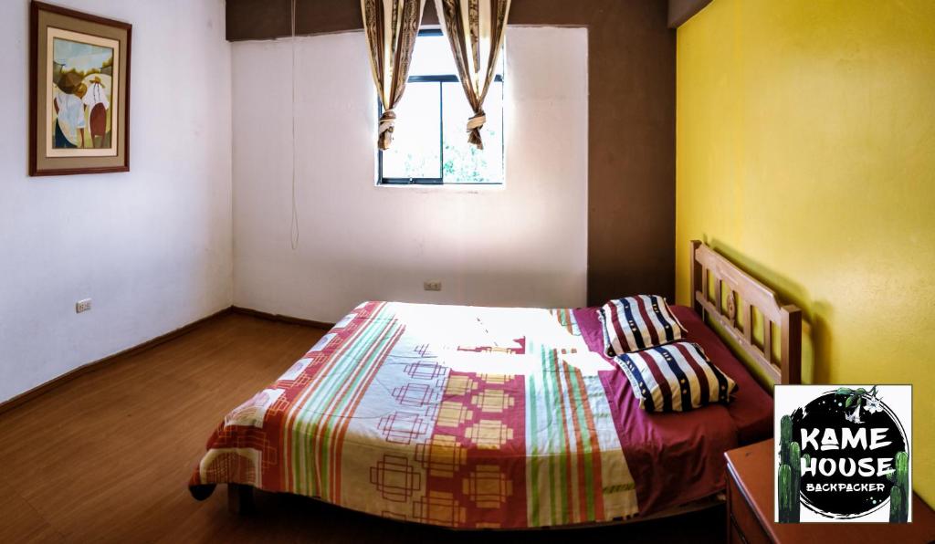 Postel nebo postele na pokoji v ubytování Kame House hostel