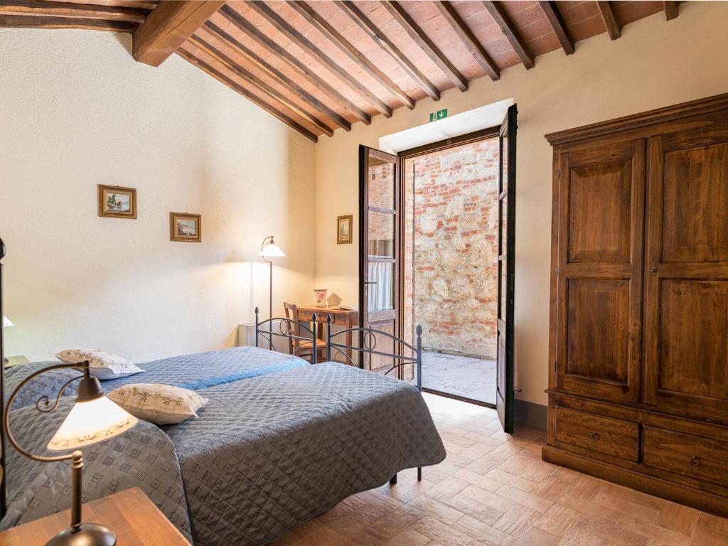 Postel nebo postele na pokoji v ubytování Agriturismo Baccoleno