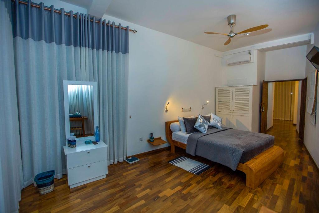 Postel nebo postele na pokoji v ubytování Villa Vajrapani