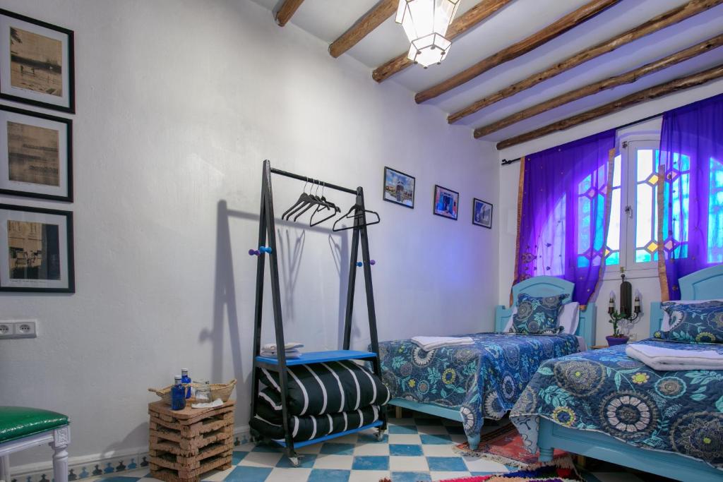 Postel nebo postele na pokoji v ubytování Afra House