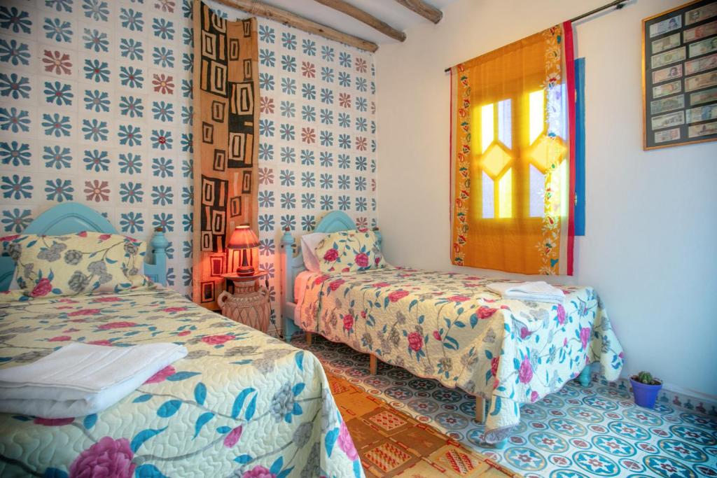 Postel nebo postele na pokoji v ubytování Afra House