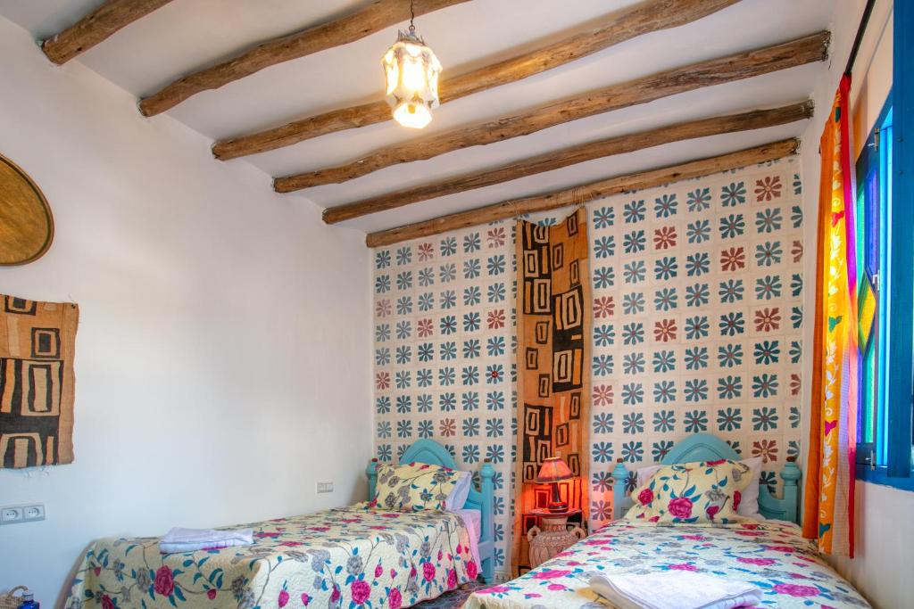 Postel nebo postele na pokoji v ubytování Afra House