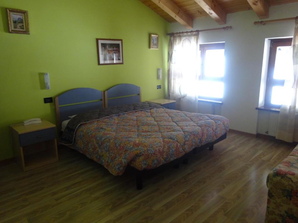 Postel nebo postele na pokoji v ubytování Hotel Genzianella