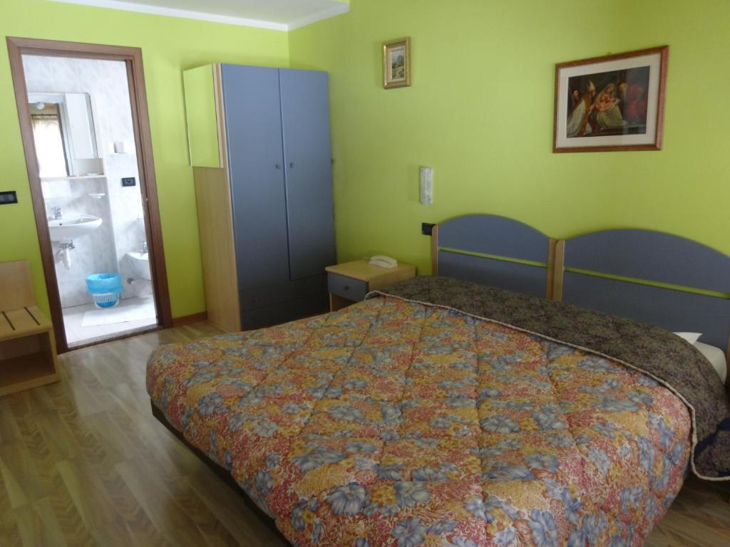 Postel nebo postele na pokoji v ubytování Hotel Genzianella