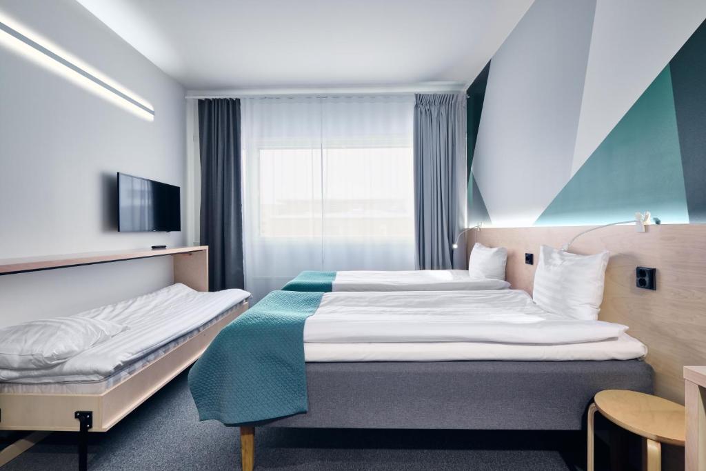 Voodi või voodid majutusasutuse GreenStar Hotel Jyväskylä toas