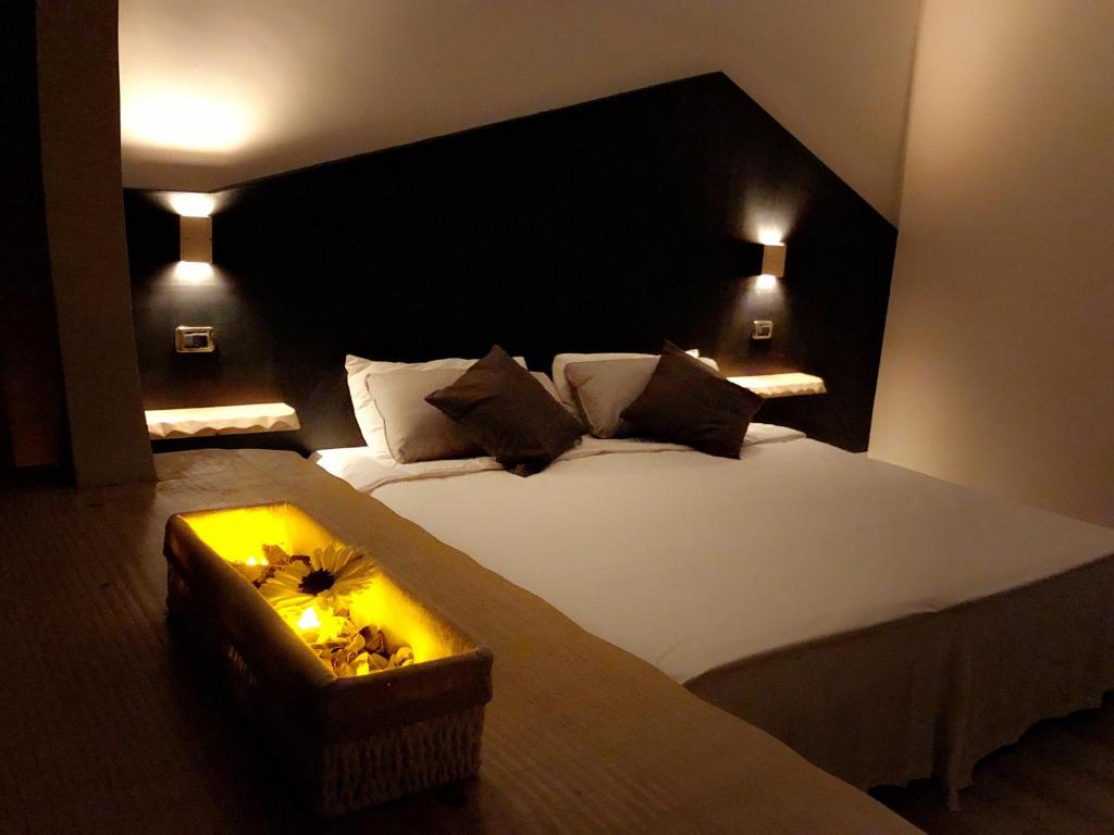 Postel nebo postele na pokoji v ubytování Hotel Paris