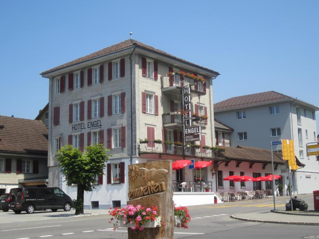 a building on the corner of a city street at Hotel Engel in Emmetten