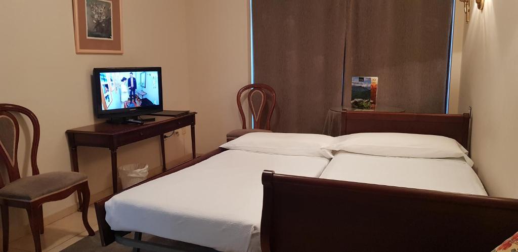 TV a/nebo společenská místnost v ubytování Gran Hotel Paraiso