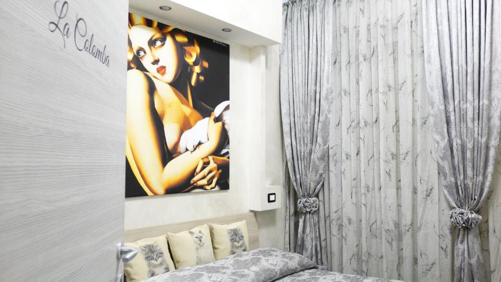 A bed or beds in a room at L'Antenna