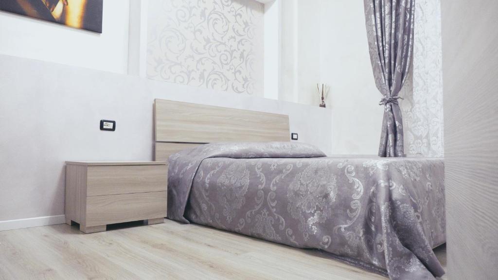 A bed or beds in a room at L'Antenna