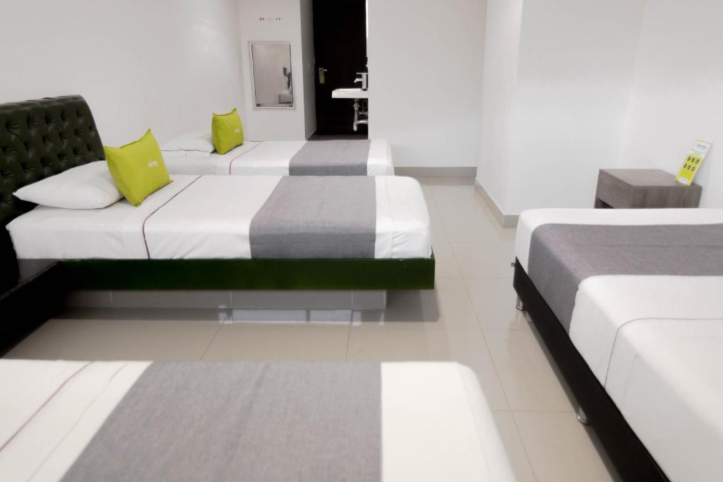 Postel nebo postele na pokoji v ubytování 3H hotel centro histórico