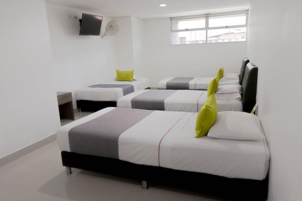 Postel nebo postele na pokoji v ubytování 3H hotel centro histórico