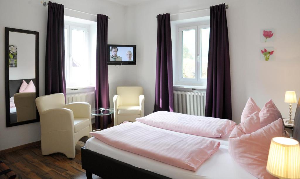 Postel nebo postele na pokoji v ubytování Hotel Hafnerwirt