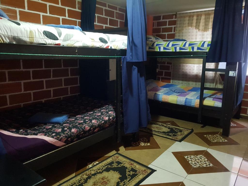 Postel nebo postele na pokoji v ubytování Hostal Sendero de Volcanes