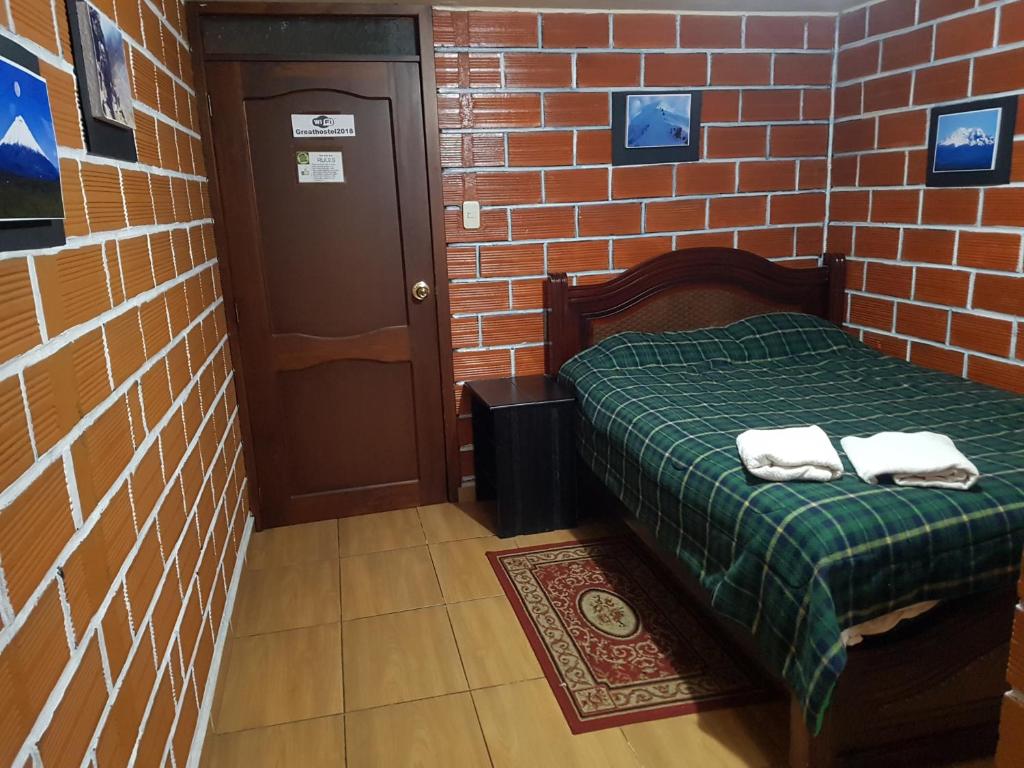 Postel nebo postele na pokoji v ubytování Hostal Sendero de Volcanes