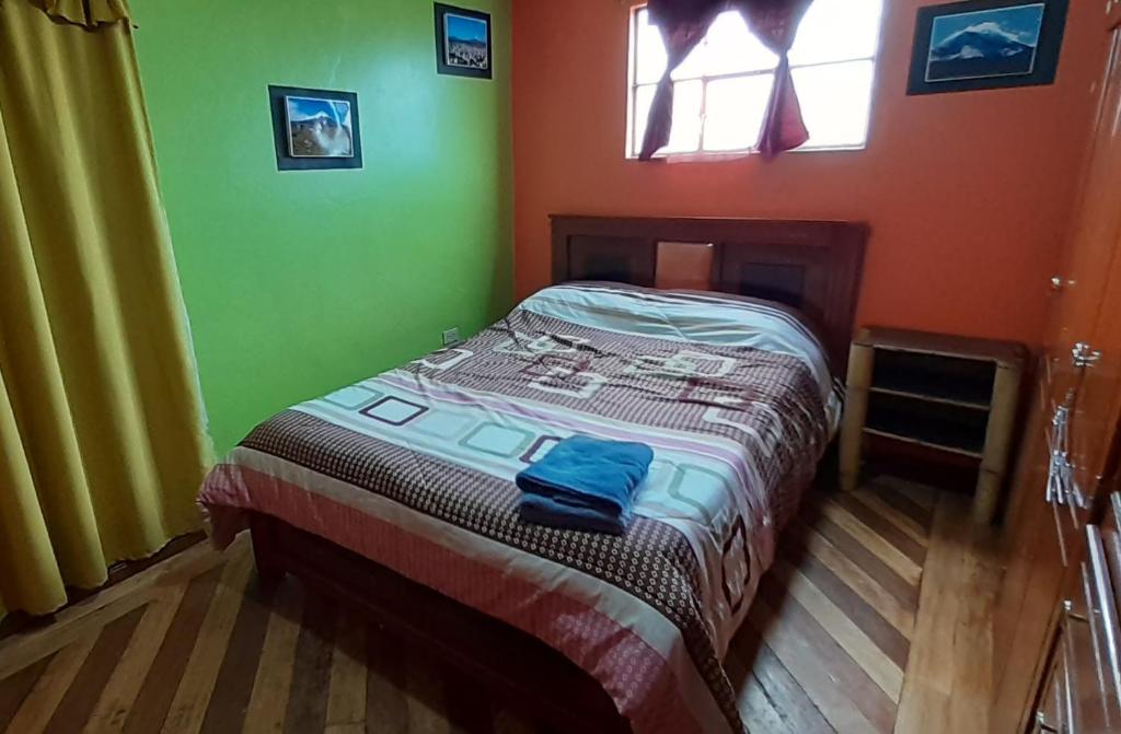 Postel nebo postele na pokoji v ubytování Hostal Sendero de Volcanes