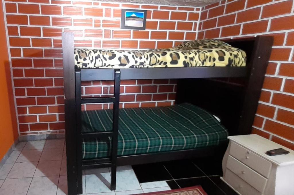 Postel nebo postele na pokoji v ubytování Hostal Sendero de Volcanes