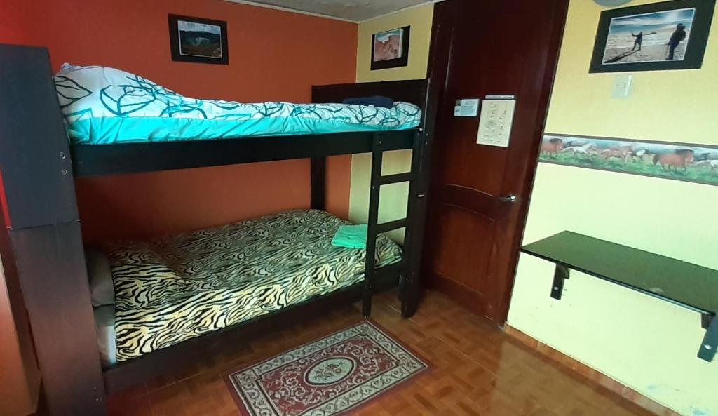 Postel nebo postele na pokoji v ubytování Hostal Sendero de Volcanes