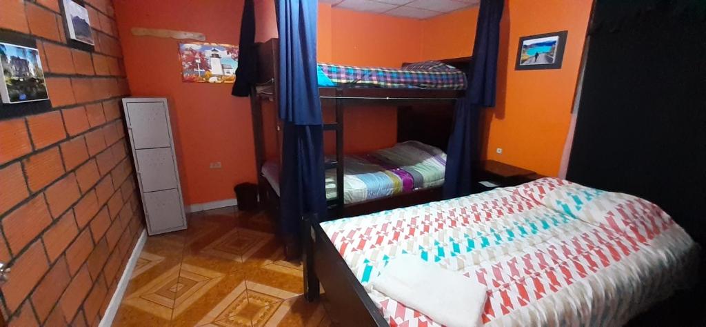 Postel nebo postele na pokoji v ubytování Hostal Sendero de Volcanes