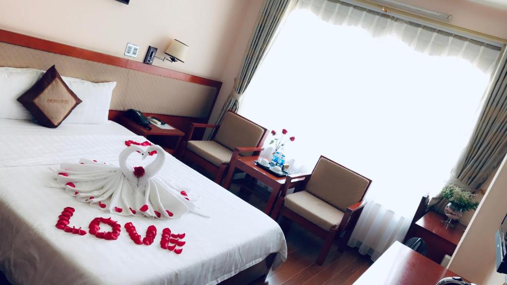 Postel nebo postele na pokoji v ubytování Paradis Hotel