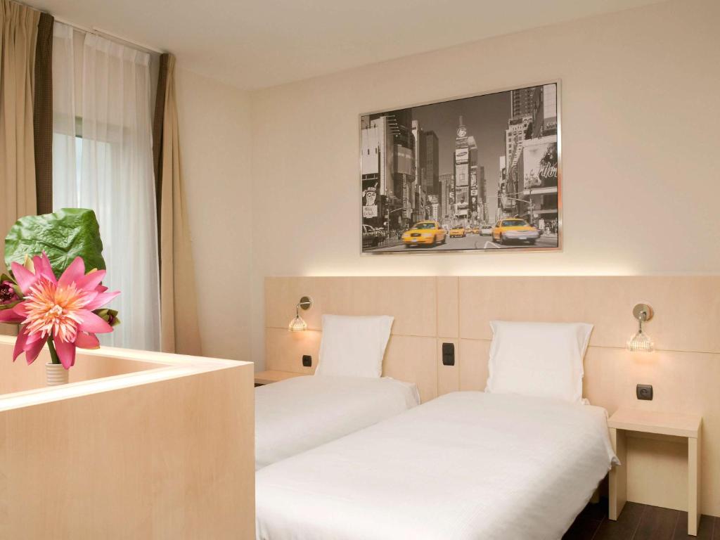 Postel nebo postele na pokoji v ubytování Ibis Styles La Louvière