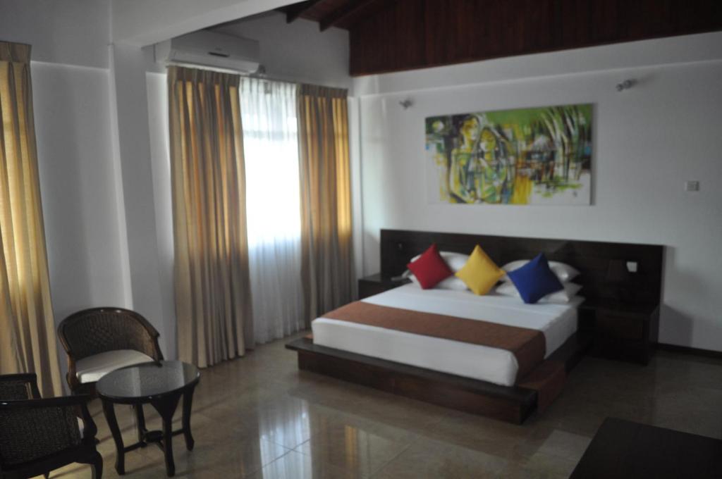 Postel nebo postele na pokoji v ubytování Amaara Sky Hotel Kandy