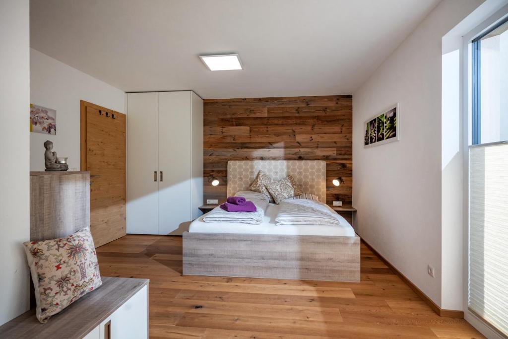 Rúm í herbergi á Appartement Steidl