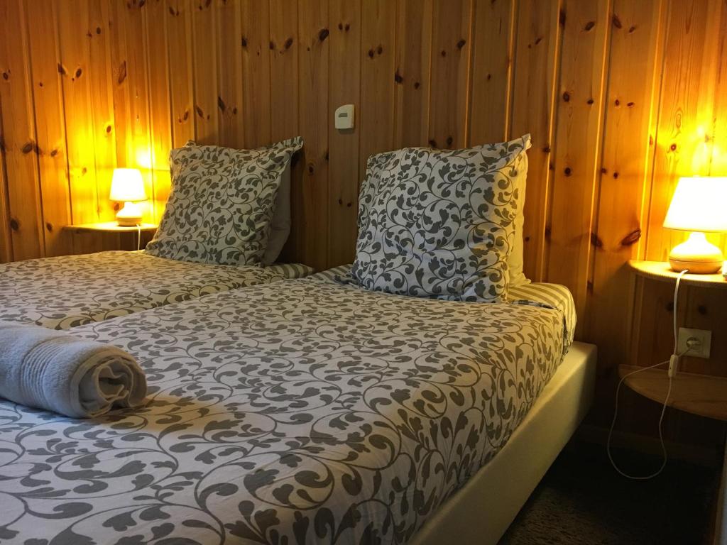 Postel nebo postele na pokoji v ubytování Hotel Le Beau Site