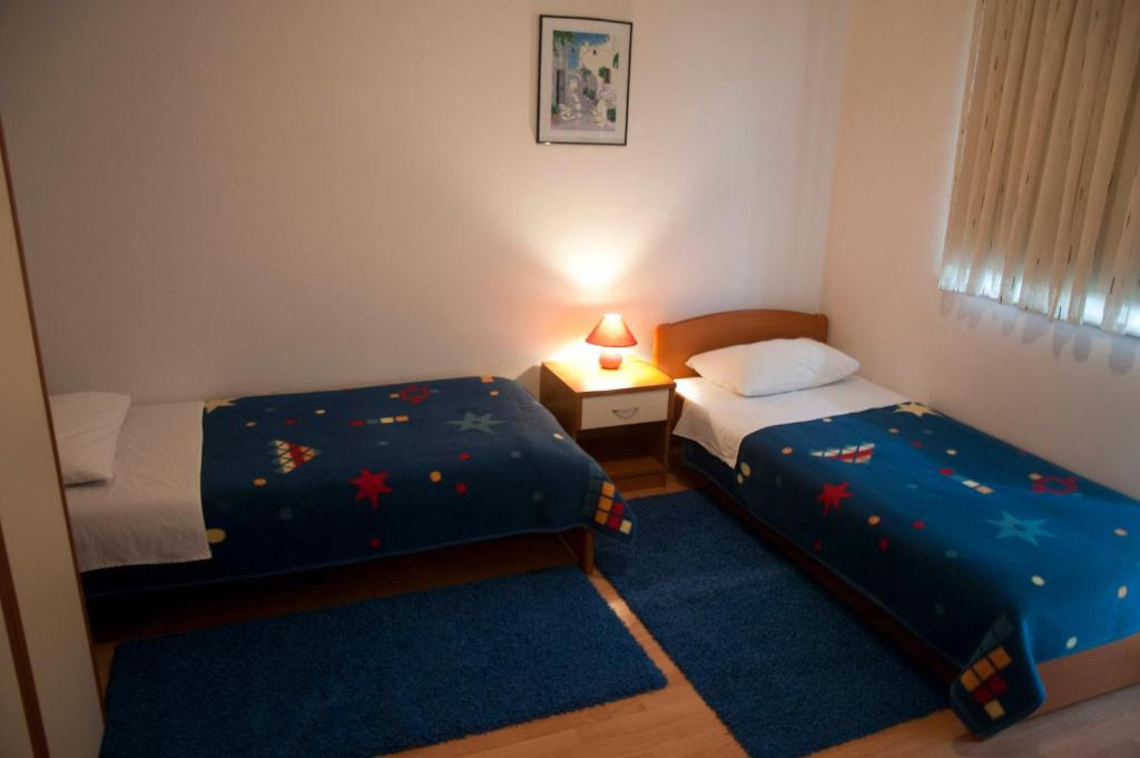 Postel nebo postele na pokoji v ubytování Hotel Metković