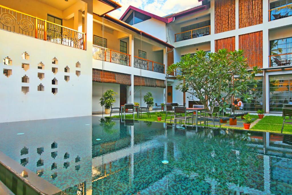 a view of the courtyard of a building with a swimming pool at Eighth Bastion Fort Kochi - CGH Earth in Cochin