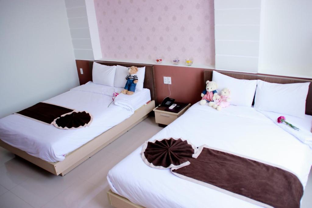 Postel nebo postele na pokoji v ubytování Princess Hotel
