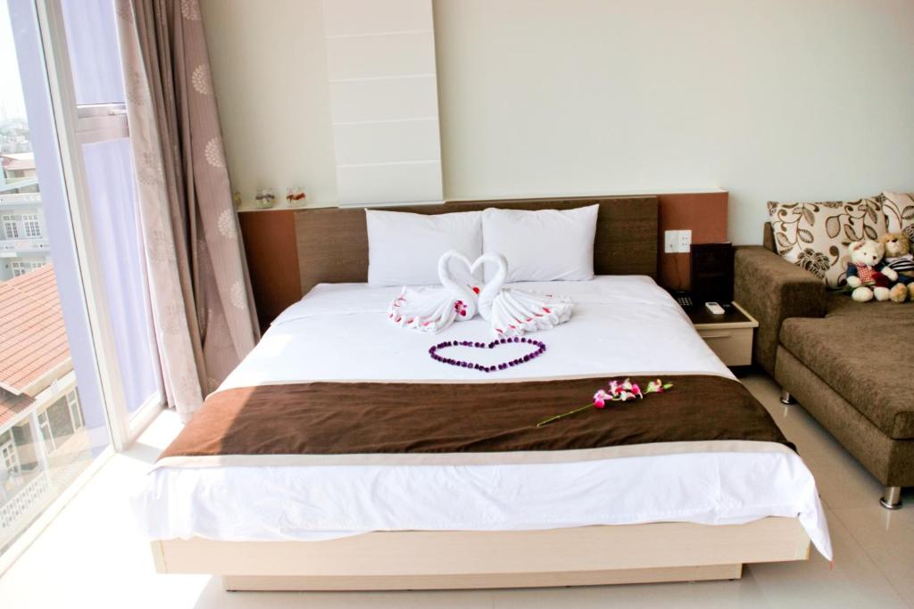 Postel nebo postele na pokoji v ubytování Princess Hotel