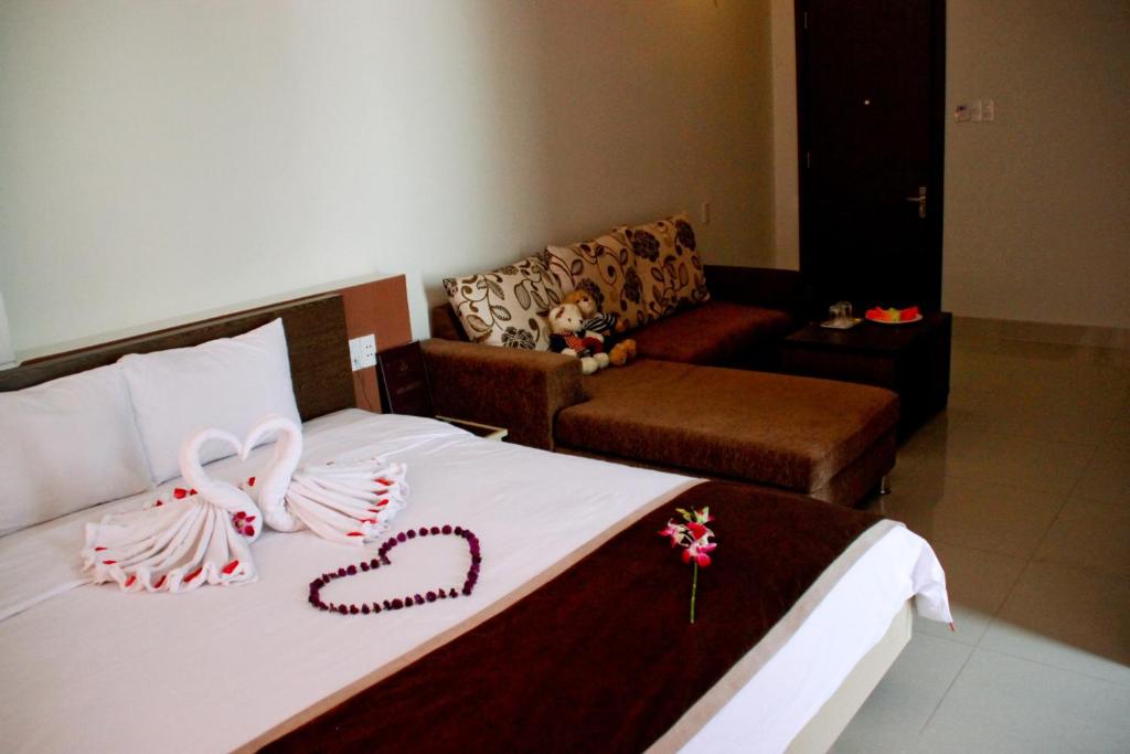 Postel nebo postele na pokoji v ubytování Princess Hotel