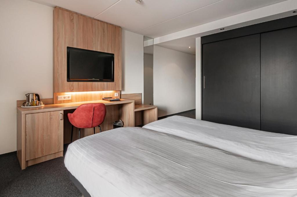 Voodi või voodid majutusasutuse Hotel Iselmar toas