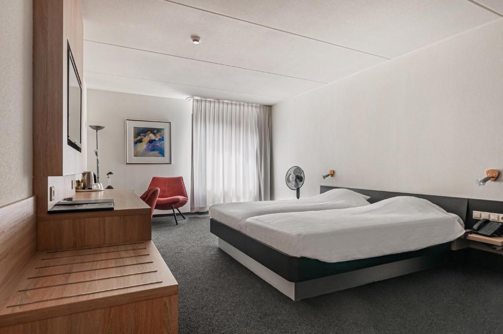 Voodi või voodid majutusasutuse Hotel Iselmar toas