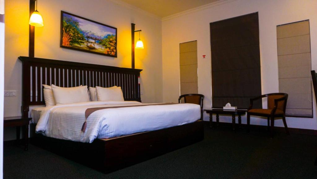 Postel nebo postele na pokoji v ubytování Hotel Nippon Colombo