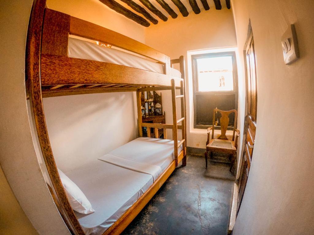 Postel nebo postele na pokoji v ubytování zLife Stone Town