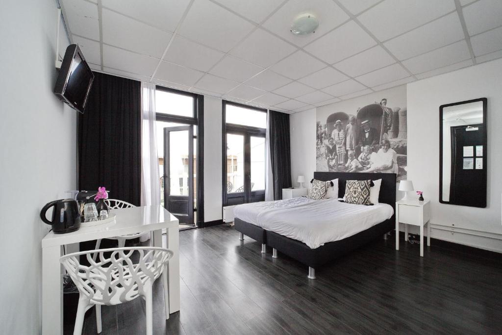 Postel nebo postele na pokoji v ubytování Hotel Zeespiegel