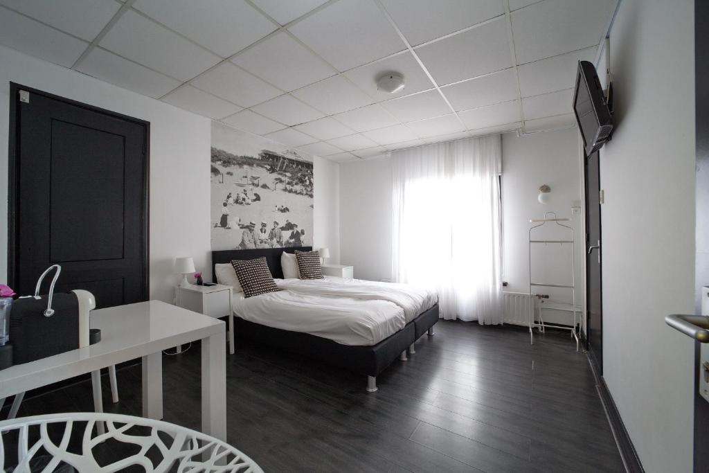 Postel nebo postele na pokoji v ubytování Hotel Zeespiegel