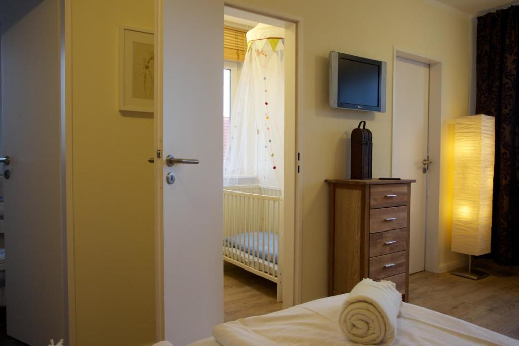 Postel nebo postele na pokoji v ubytování Das Frühstückshotel Sankt Peter-Ording