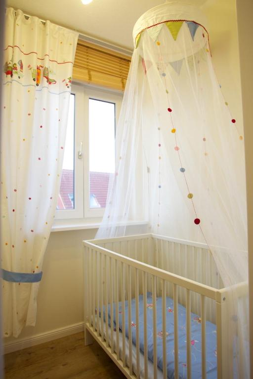Postel nebo postele na pokoji v ubytování Das Frühstückshotel Sankt Peter-Ording