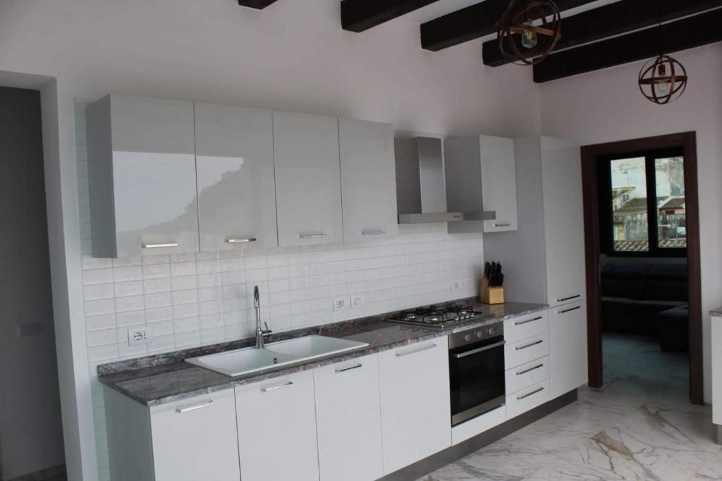 A kitchen or kitchenette at Palazzo del Golfo Penthouse