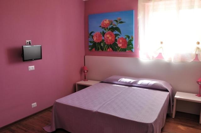 Postel nebo postele na pokoji v ubytování I Tre Fiori